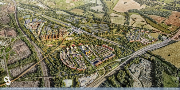 Aerial view of a suburban area with residential buildings, roads, green spaces, and surrounding farmland, showing an interconnected network of streets and features.